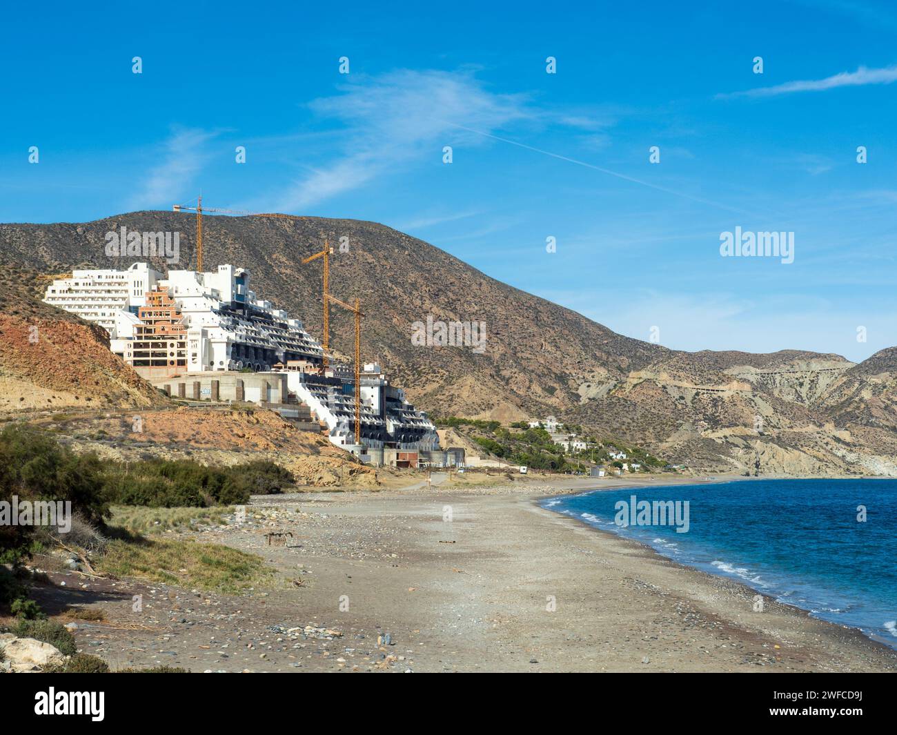 Illegal construction of the abandoned Algarrobico hotel in the natural park of Cabo de Gata in Carboneras, Almeria, Spain. Stock Photo