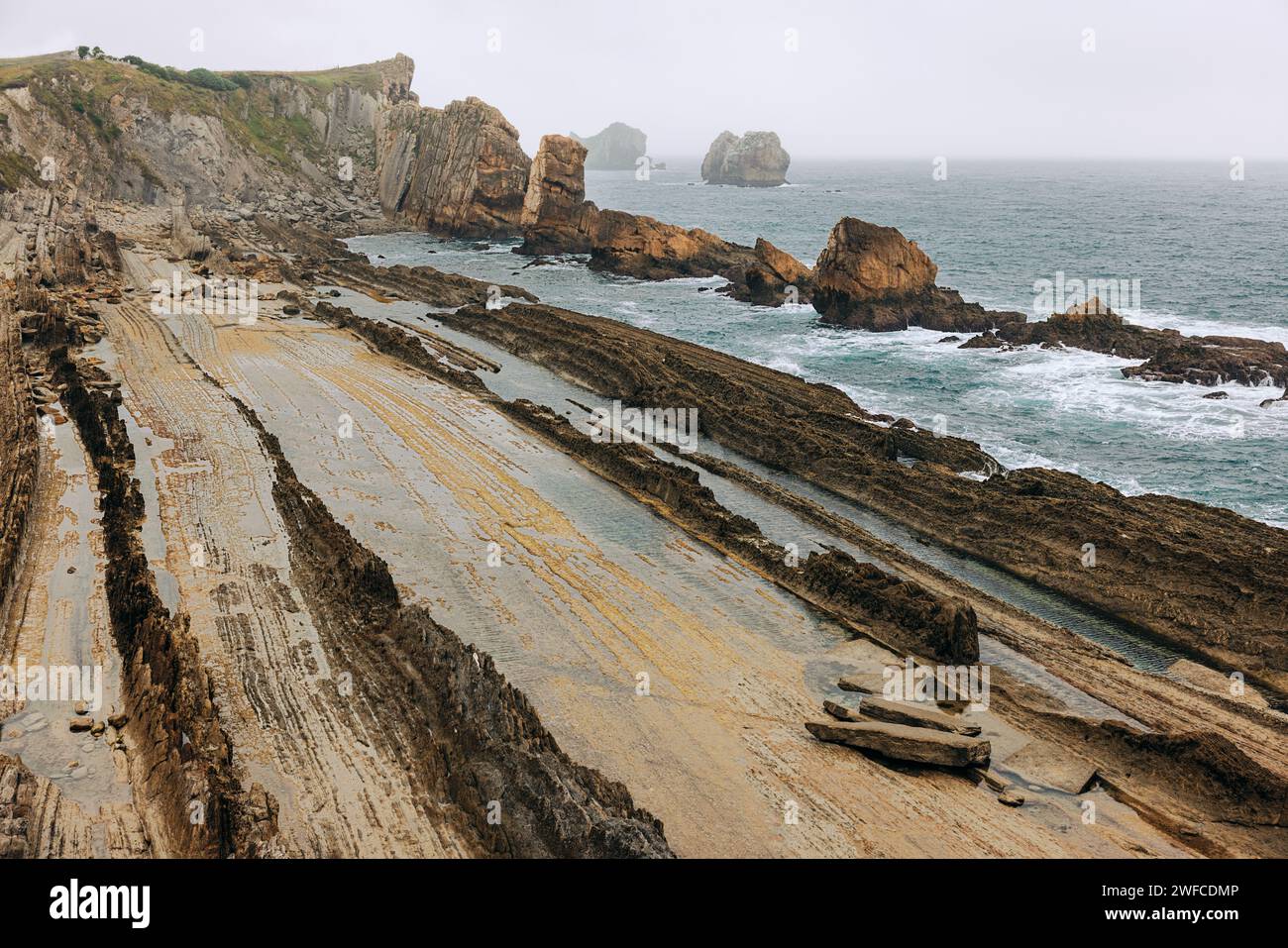 The geological park in Cantabria, near Santander. The unique flysch rock formations. The dramatic coastline Stock Photo