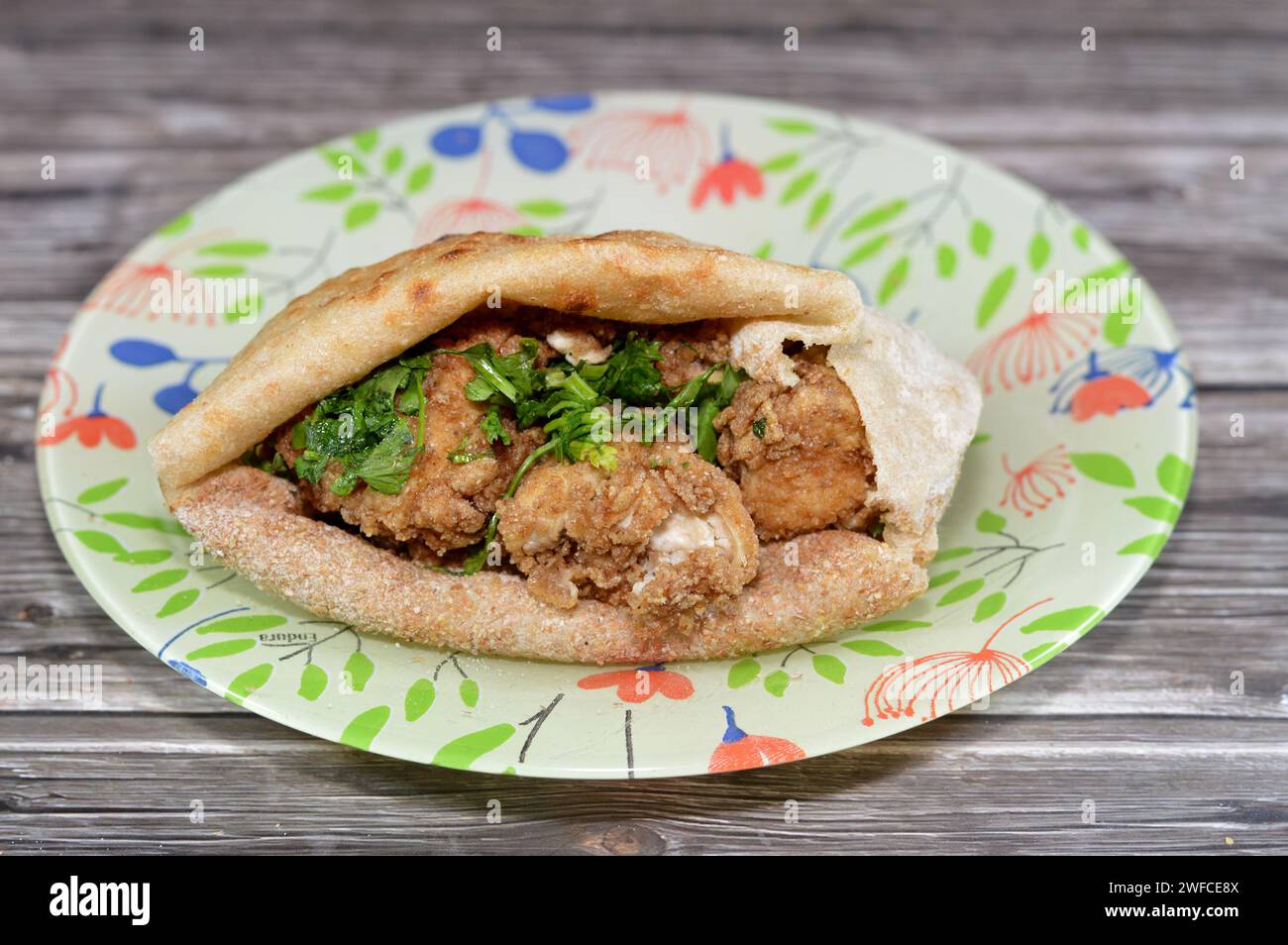Cow beef brain covered with flour and fried in deep hot oil, a sandwich
