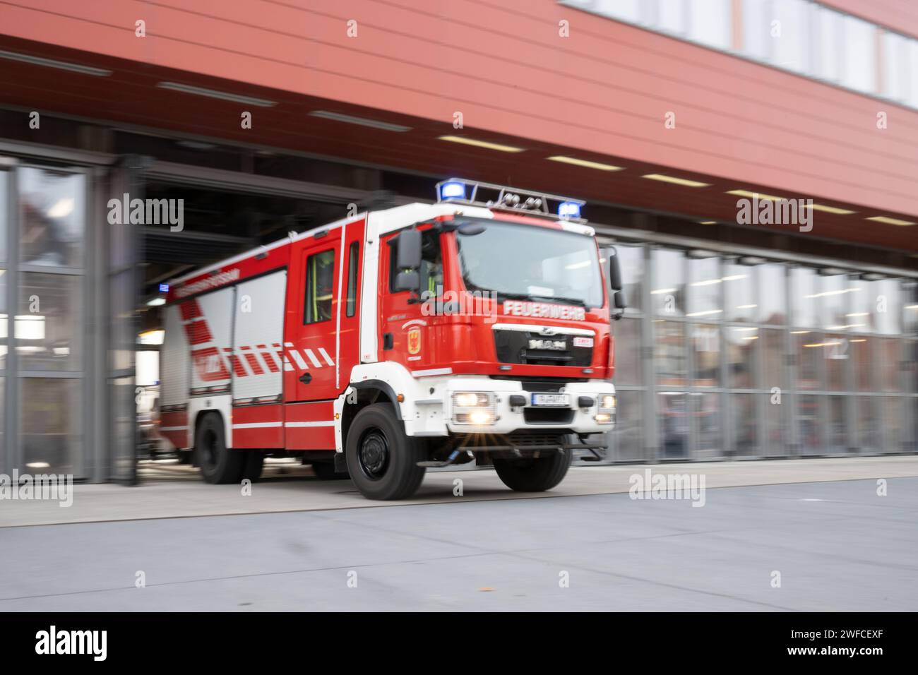 Potsdam, Germany. 30th Jan, 2024. An emergency vehicle of the fire