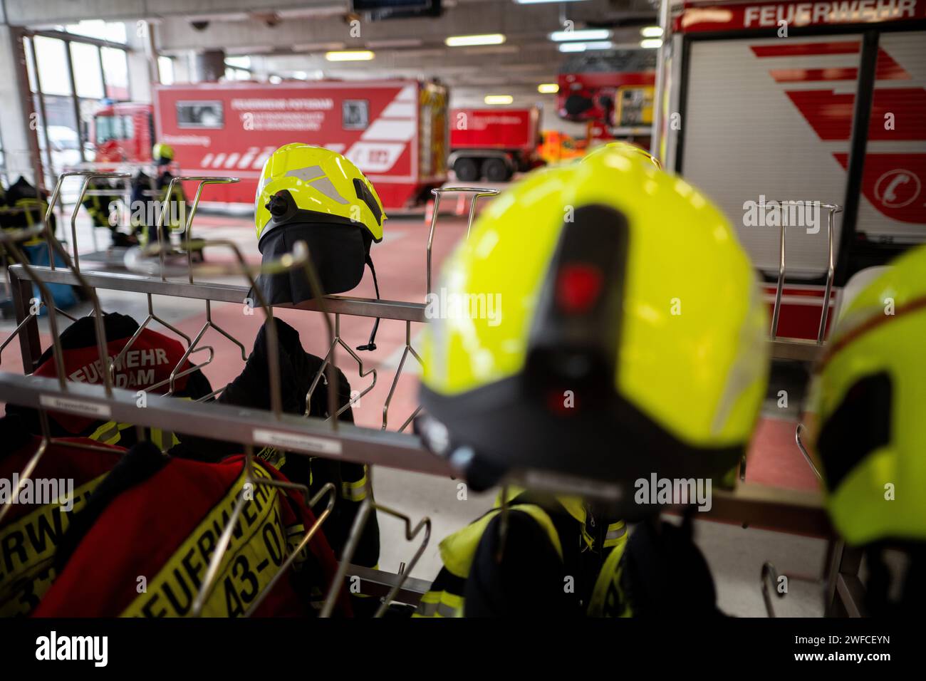 Potsdam, Germany. 30th Jan, 2024. Firefighters' turnout gear hangs in the vehicle hall during the presentation of the Potsdam Fire and Rescue Service's balance sheet. Credit: Sebastian Christoph Gollnow/dpa/Alamy Live News Stock Photo