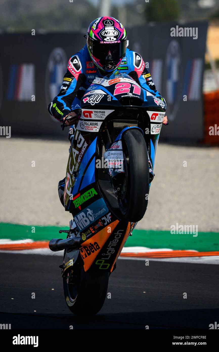 Spanish Moto2 rider Alonso Lopez celebrating the end of the championship by doing a wheelie on his bike at the Valencia Grand Prix in Spain. Stock Photo