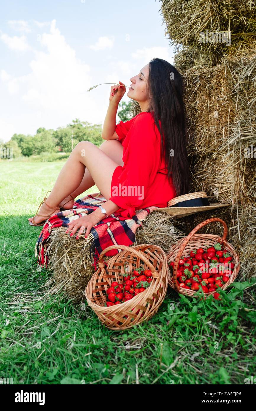 Portrait of Smiling Woman with Basket of Strawberries Stock Photo - Alamy