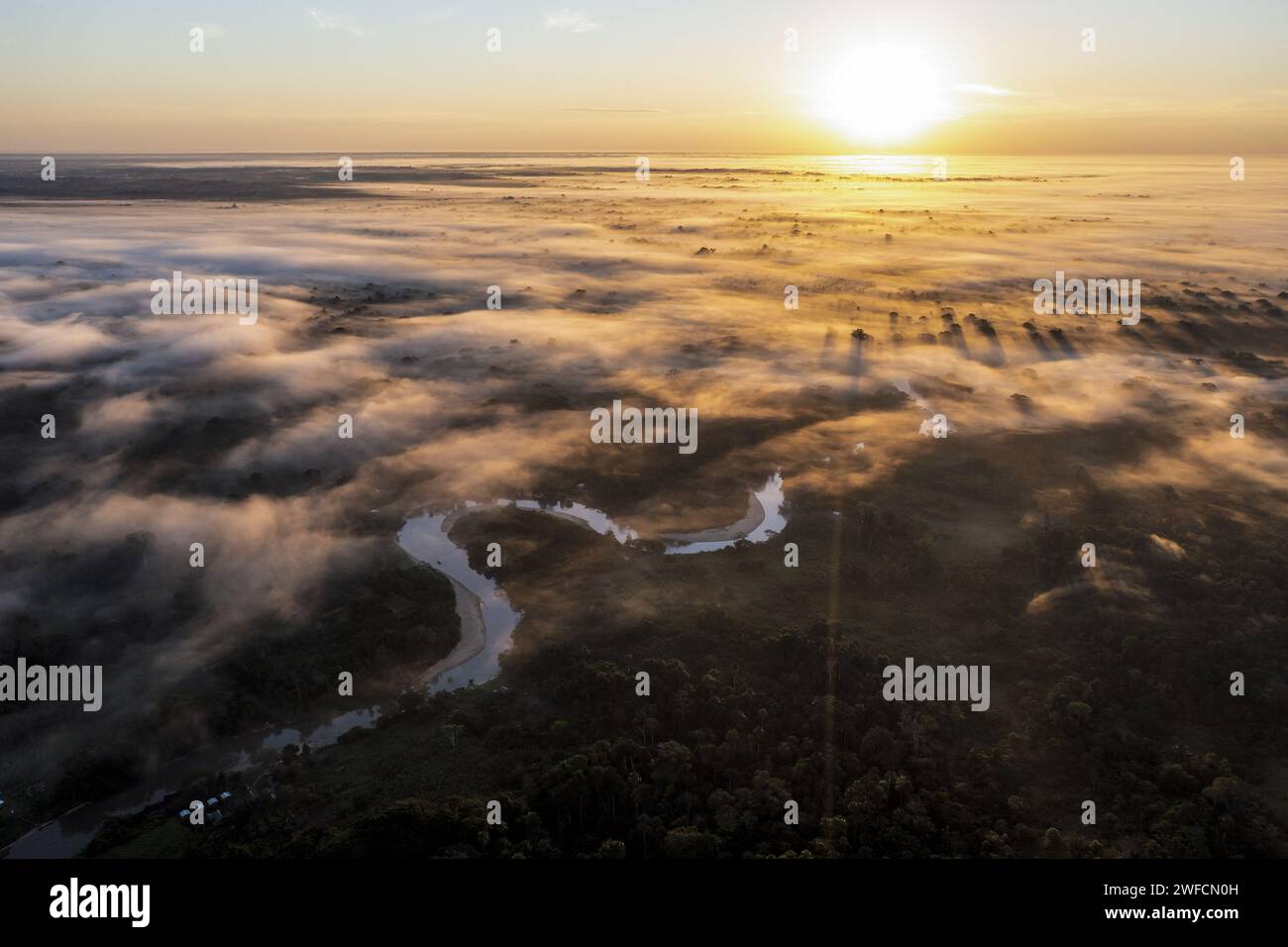 Sunrise landscape drone view with fog over Amazon forest and Moa river - Serra do Divisor National Park - Stock Photo