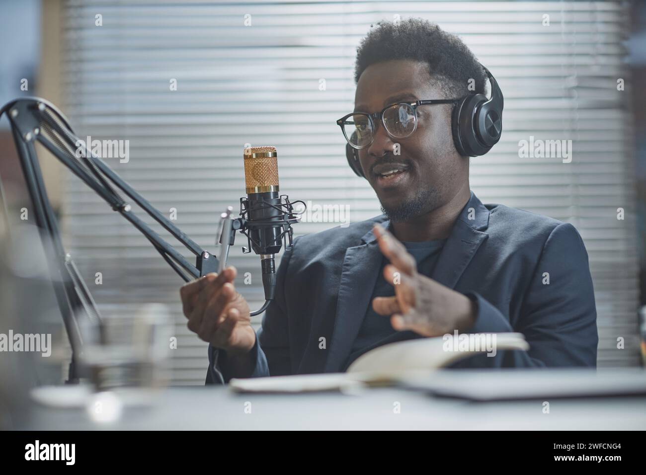 Confident Man Giving Speech during Podcast Stock Photo