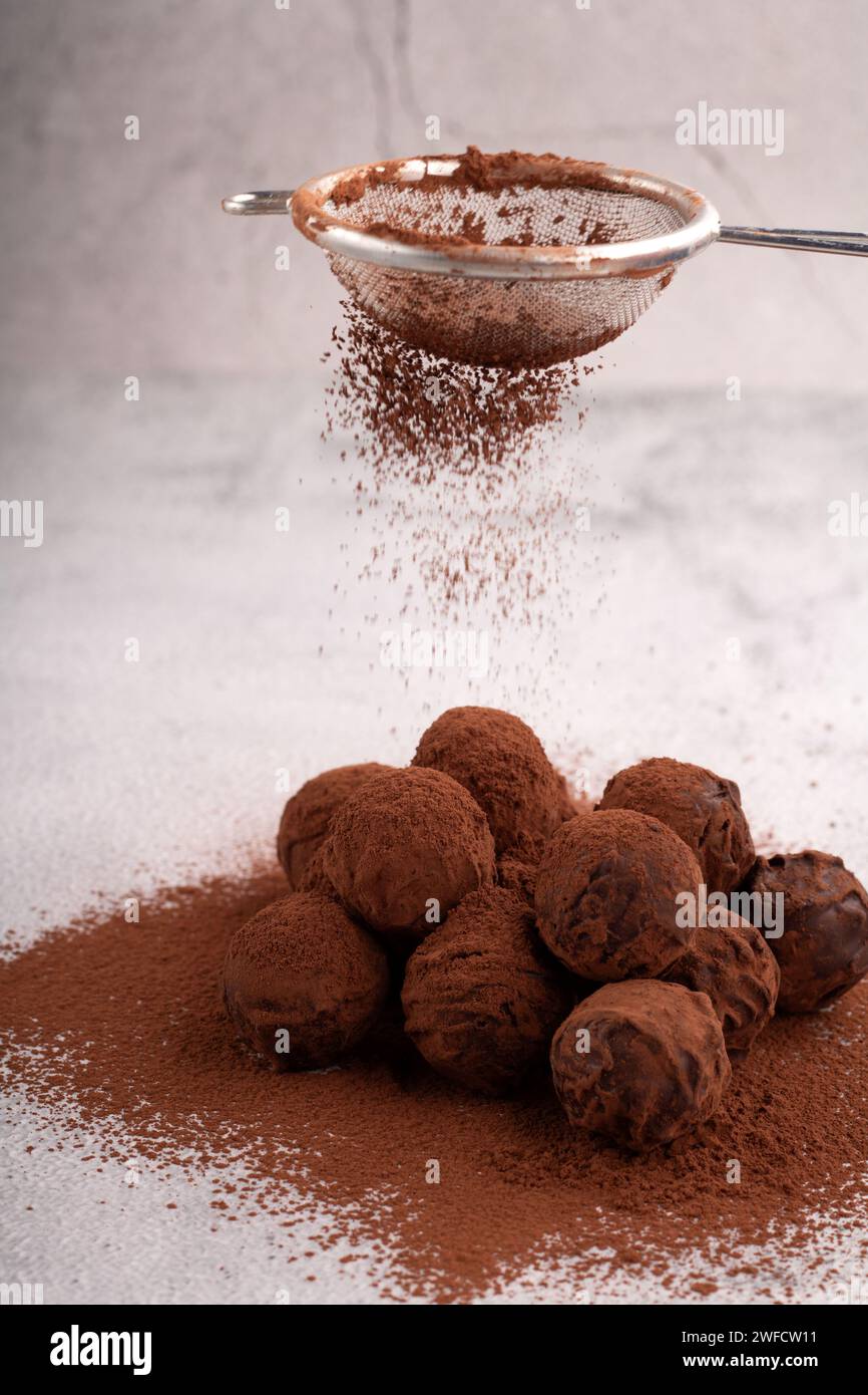 truffle, cocoa, sweet food, candy, food, homemade, brown, bonbon, round, heap, confectionery, luxury, background, isolated, photography, vertical Stock Photo