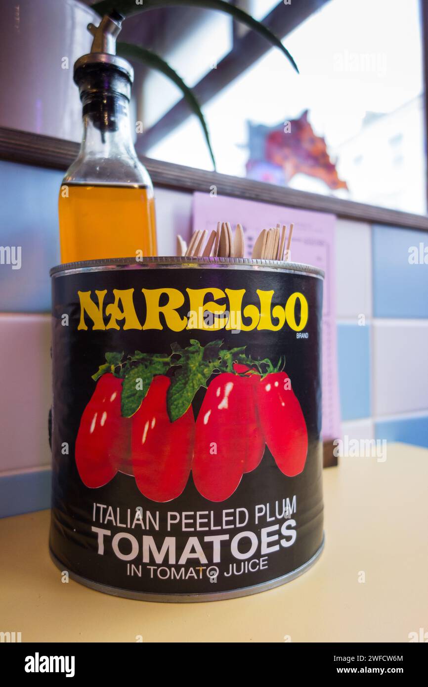 Close up of a Narello Italian Plumed Peeled Tomatoes in Tomato Juice tin can in a pizza restaurant Stock Photo