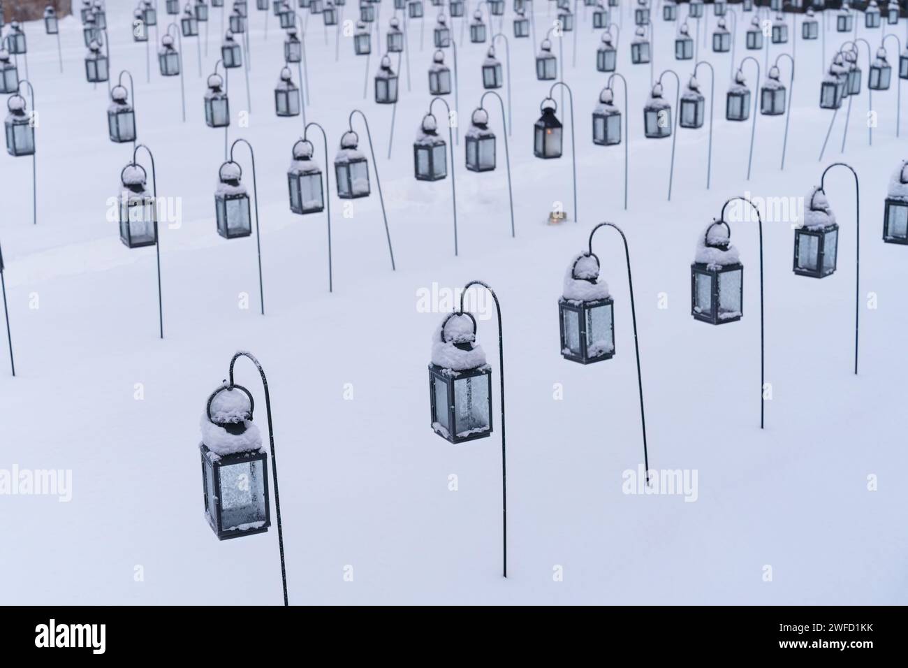 Group of empty lanterns in a cemetery in winter. Stock Photo