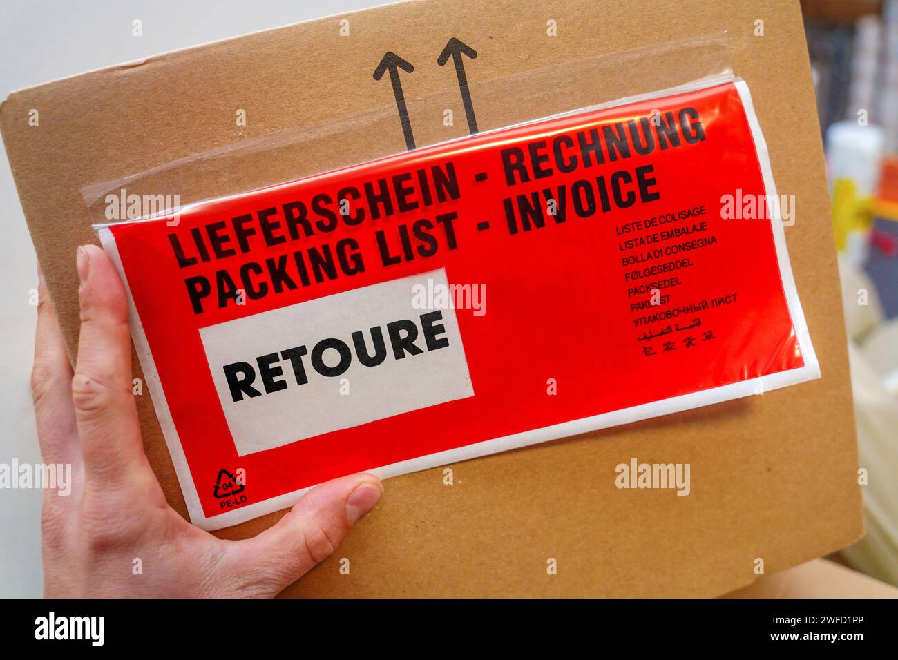 January 30, 2024 Parcel labeled Returns. Symbolic image of parcel and