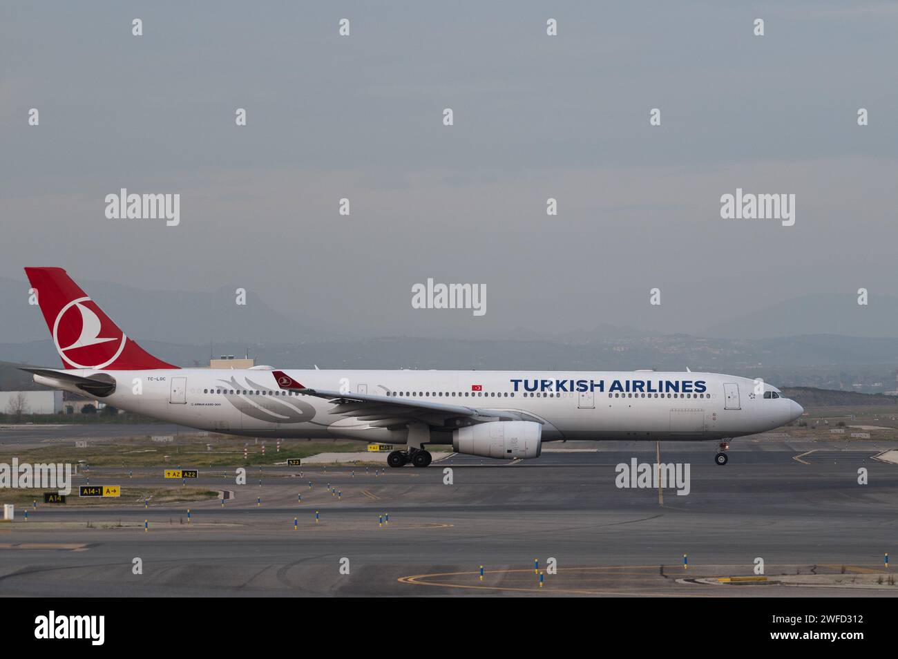 An Airbus A330 commercial flight of Turkish Airlines in a runway of Adolfo Suarez Madrid-Barajas Airport. Stock Photo
