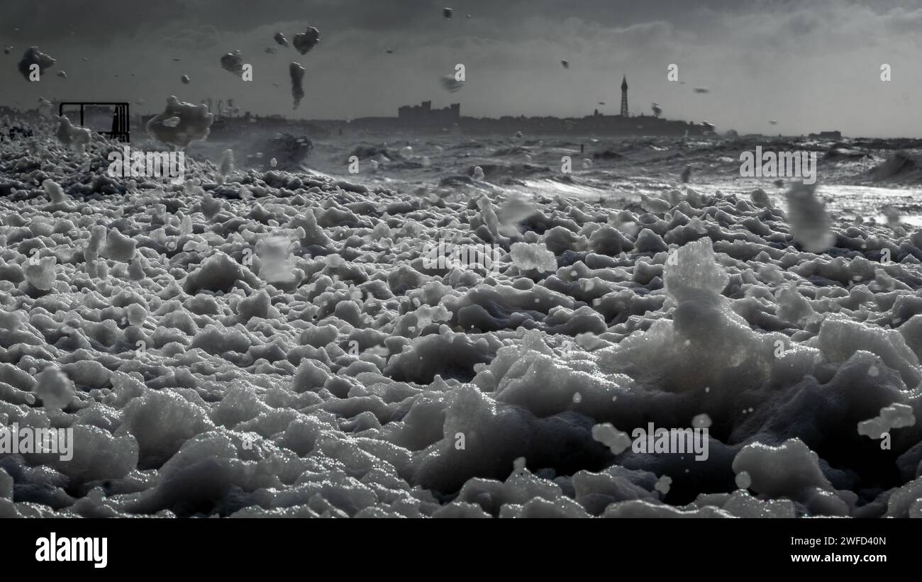 Dramatic Black and White Sea Foam and Cityscape Stock Photo