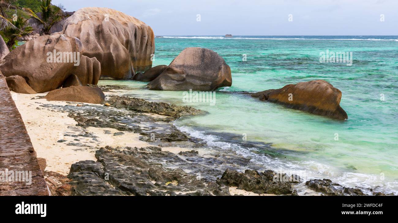 Landscape with rocks on the Anse Union beach. La Digue island, Seychelles Stock Photo