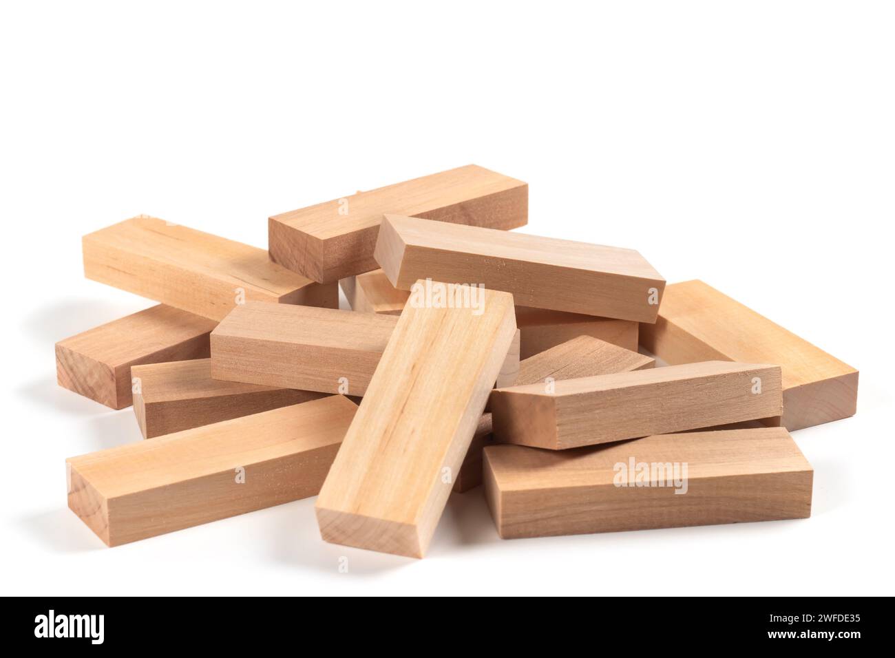 Heap of wooden blocks tower game isolated on white Stock Photo - Alamy