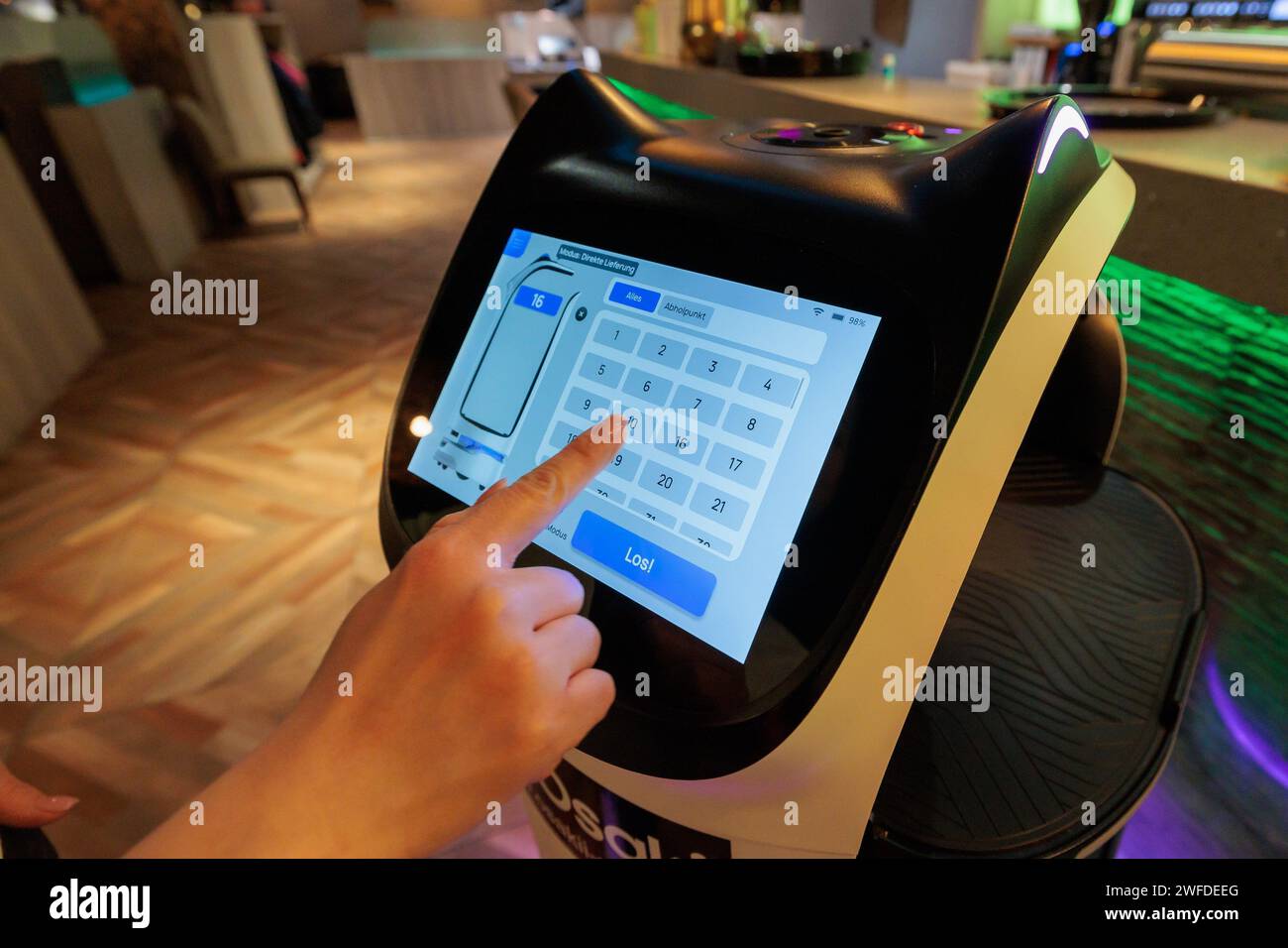 Mainz, Germany. 29th Jan, 2024. 'Bella', an autonomous service robot with a friendly cat face, is programmed via a display in the Asian restaurant 'Osakii' in Mainz. Robots can help with labor shortages in the catering industry. Credit: Jörg Halisch/dpa/Alamy Live News Stock Photo