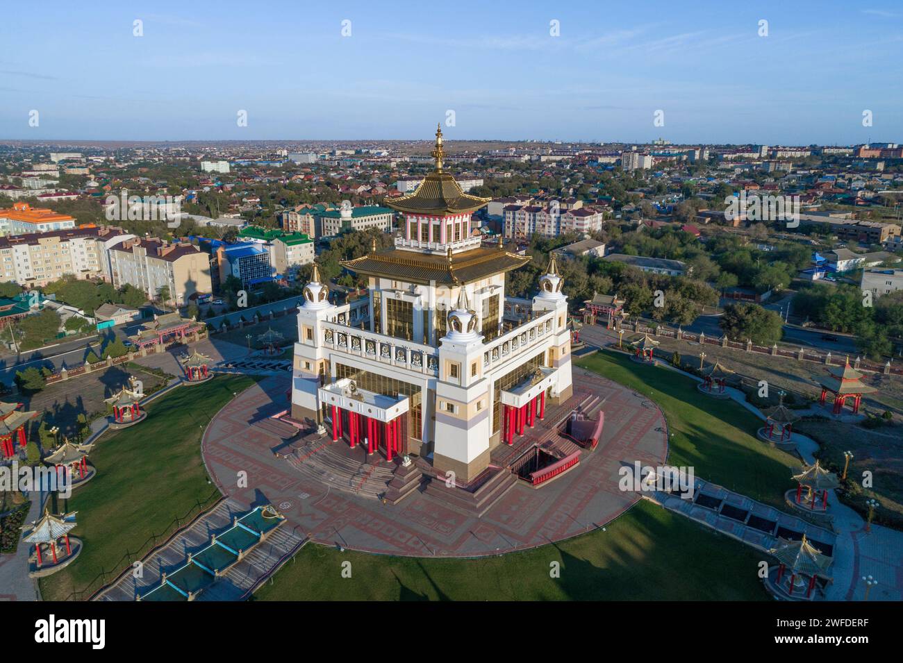 Buddhist temple 'Golden Abode of Buddha Shakyamuni' against the background of the city landscape on a sunny September morning (aerial photography) Stock Photo