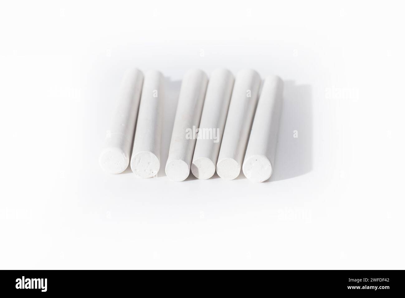 white chalk sticks isolated on white background Stock Photo Alamy