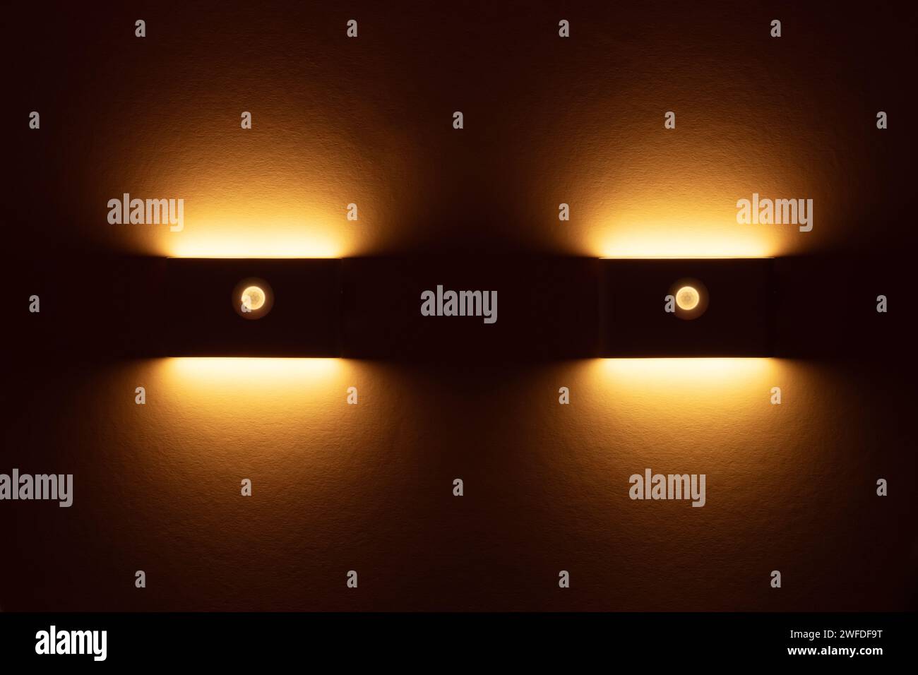 Two small solar night led light with motion sensor on wall Stock Photo