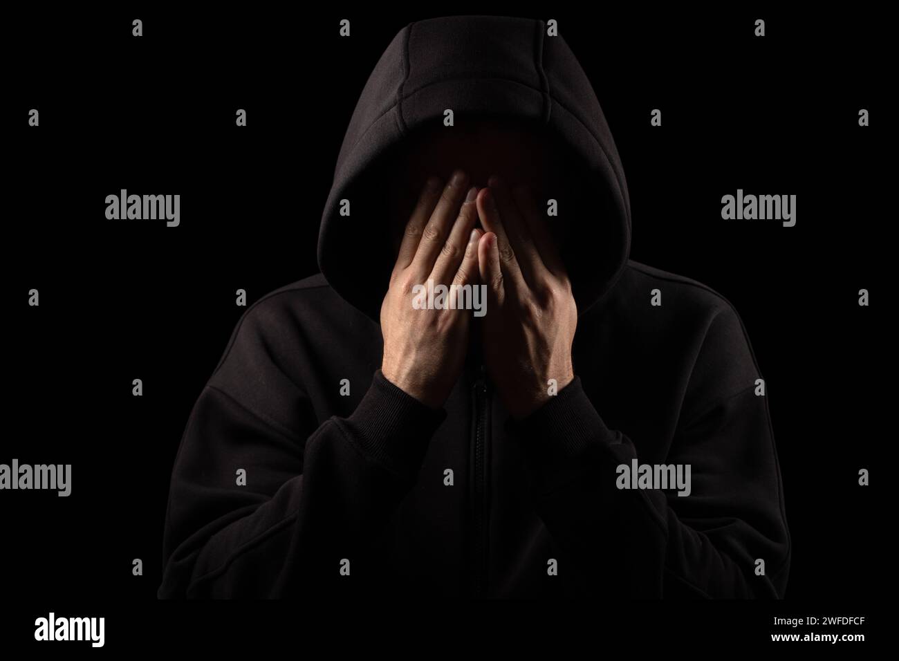 Silhouette of handcuffed male in hoodie, dangerous criminal punished by law Stock Photo