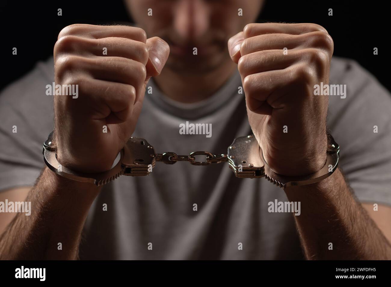 A criminal in handcuffs in front. Arrest for murder Stock Photo Alamy