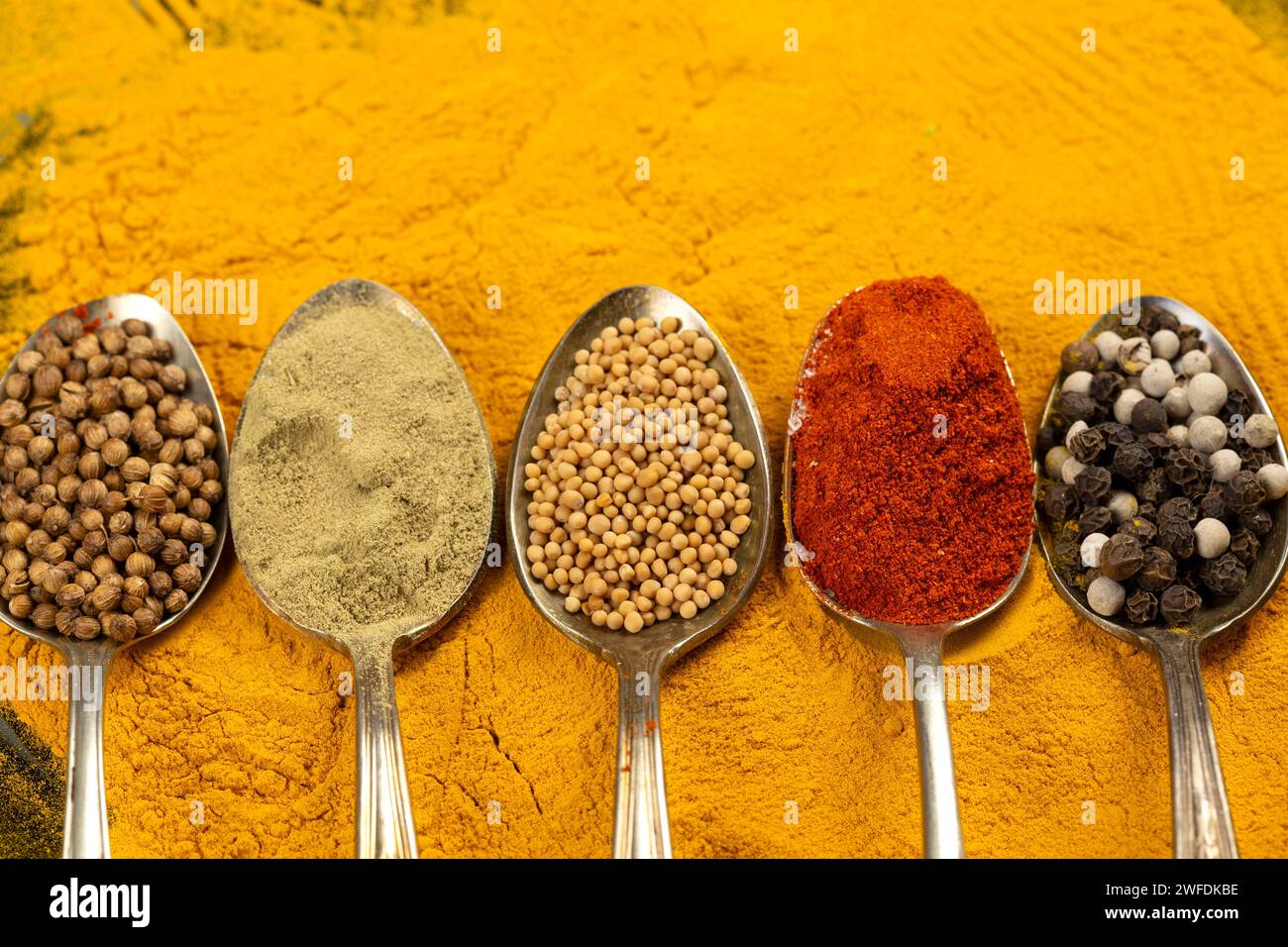 Various spices in vintage spoons Stock Photo