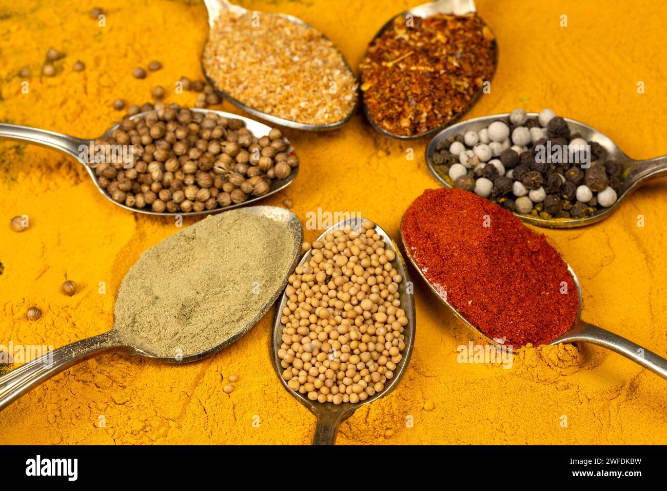 Various spices in vintage spoons Stock Photo