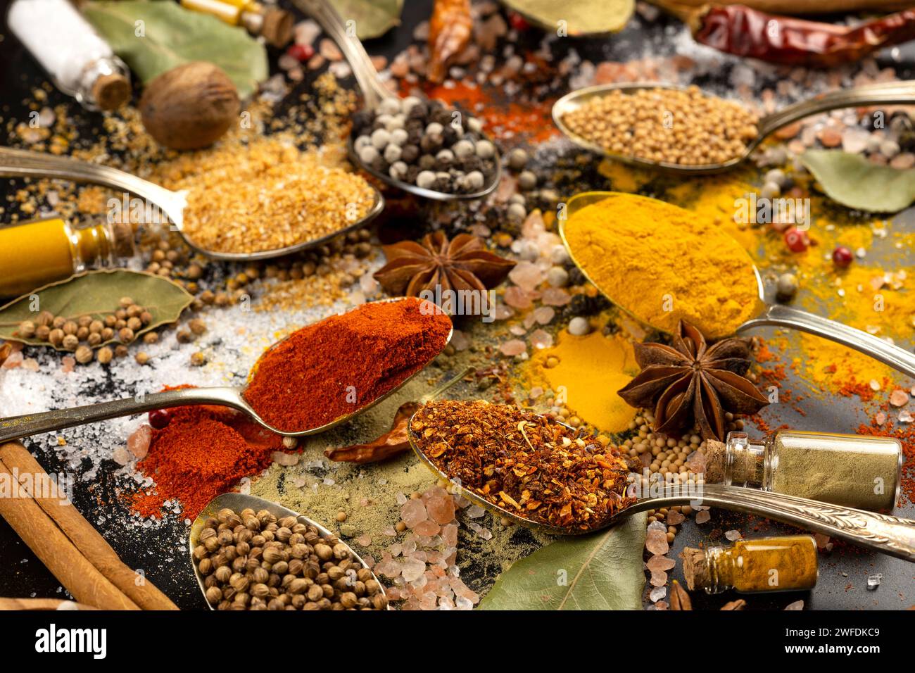 Various spices in vintage spoons Stock Photo