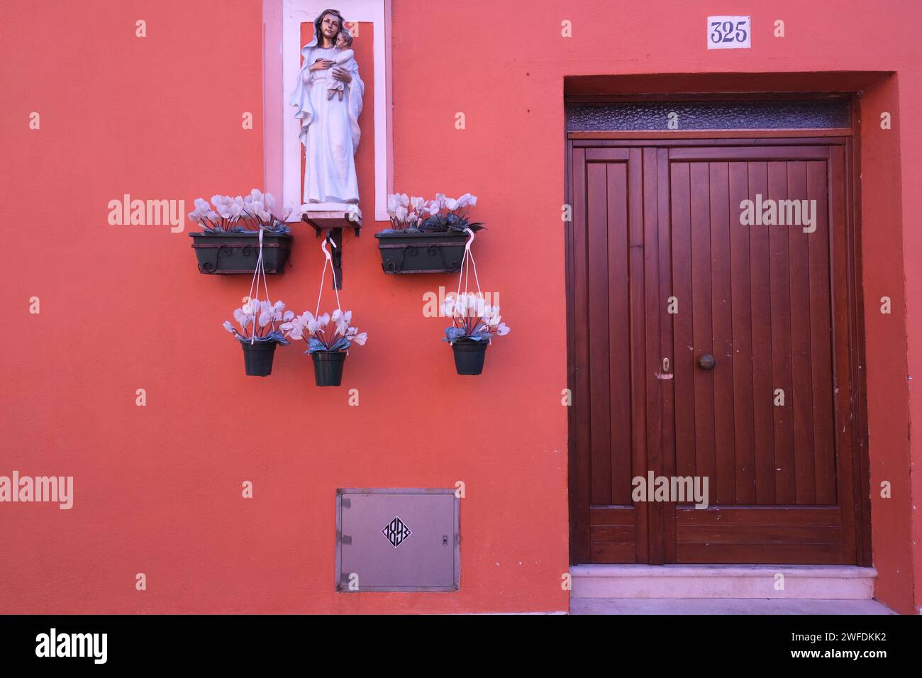 The colorful entrances to houses on the island of Burano near venice Stock Photo