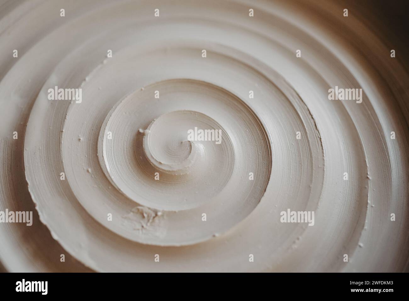 A beautiful spiral, a helical line on a clay surface Stock Photo