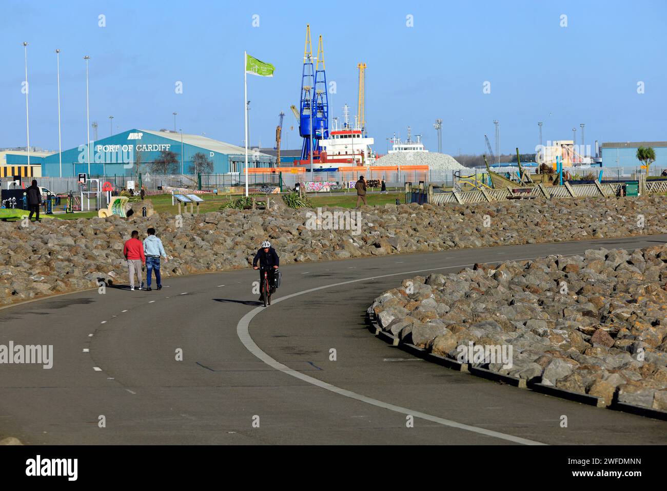 Cyclist and walkers on the Barrage, Cardiff bay, Cardiff, South Wales. Stock Photo