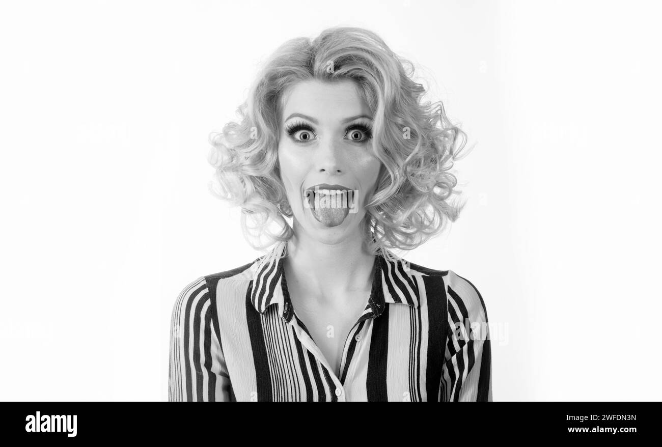 Beautiful modern model shows tongue. Model with sticking tongue out