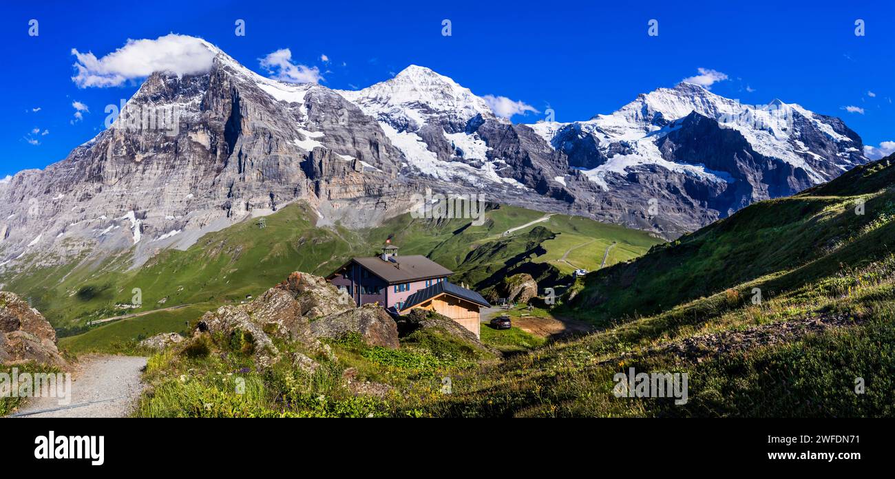 amazing Swiss nature . Kleine Scheidegg mountain pass  famous for hiking in Bernese Alps. view of highest peaks Eiger , Monc and Jungfrau, Switzerland Stock Photo