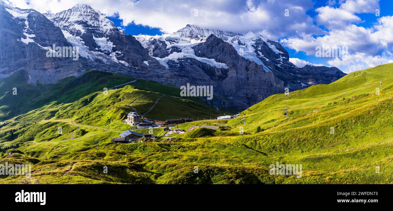 amazing Swiss nature . Kleine Scheidegg mountain pass  famous for hiking in Bernese Alps. view of highest peaks Eiger , Monc and Jungfrau, Switzerland Stock Photo