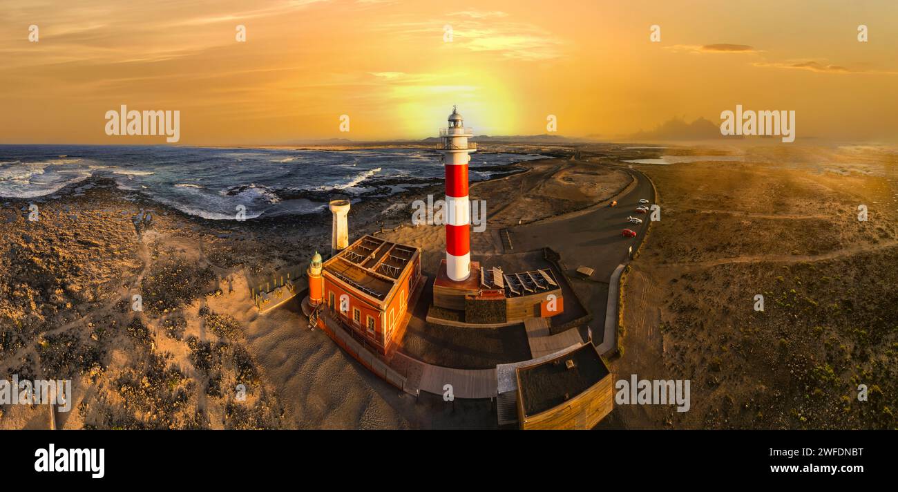scenic  landscape with lighthouse over sunset. aerial drone view, Fuerteventura . Canary island, El Cotilio village. El Toston lighthouse Stock Photo