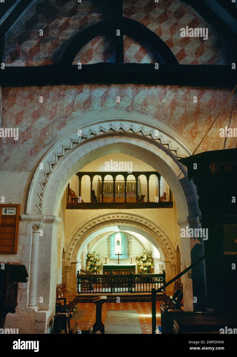 St Nicholas' Church, Compton, Surrey, England, UK, showing the chancel arch with the Norman (late C12th) upper & lower sanctuary chapels beyond. Stock Photo