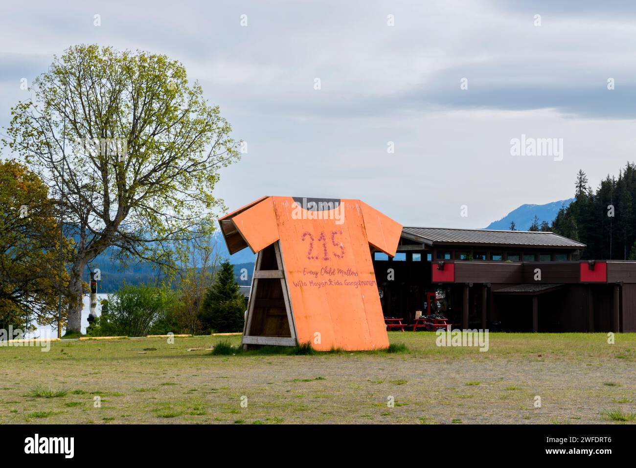 A large public art cut-out of an orange shirt memorializes the loss of indigenous children in Canadian residential schools, in the community of Yalis Stock Photo