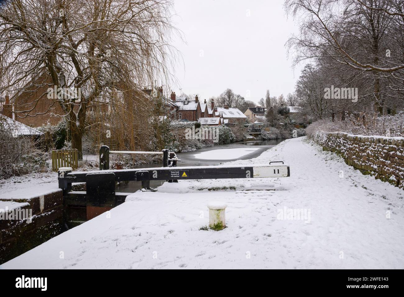 Homes beside the Peak Forest Canal at Marple, Stockport, Greater Manchester, England. Stock Photo