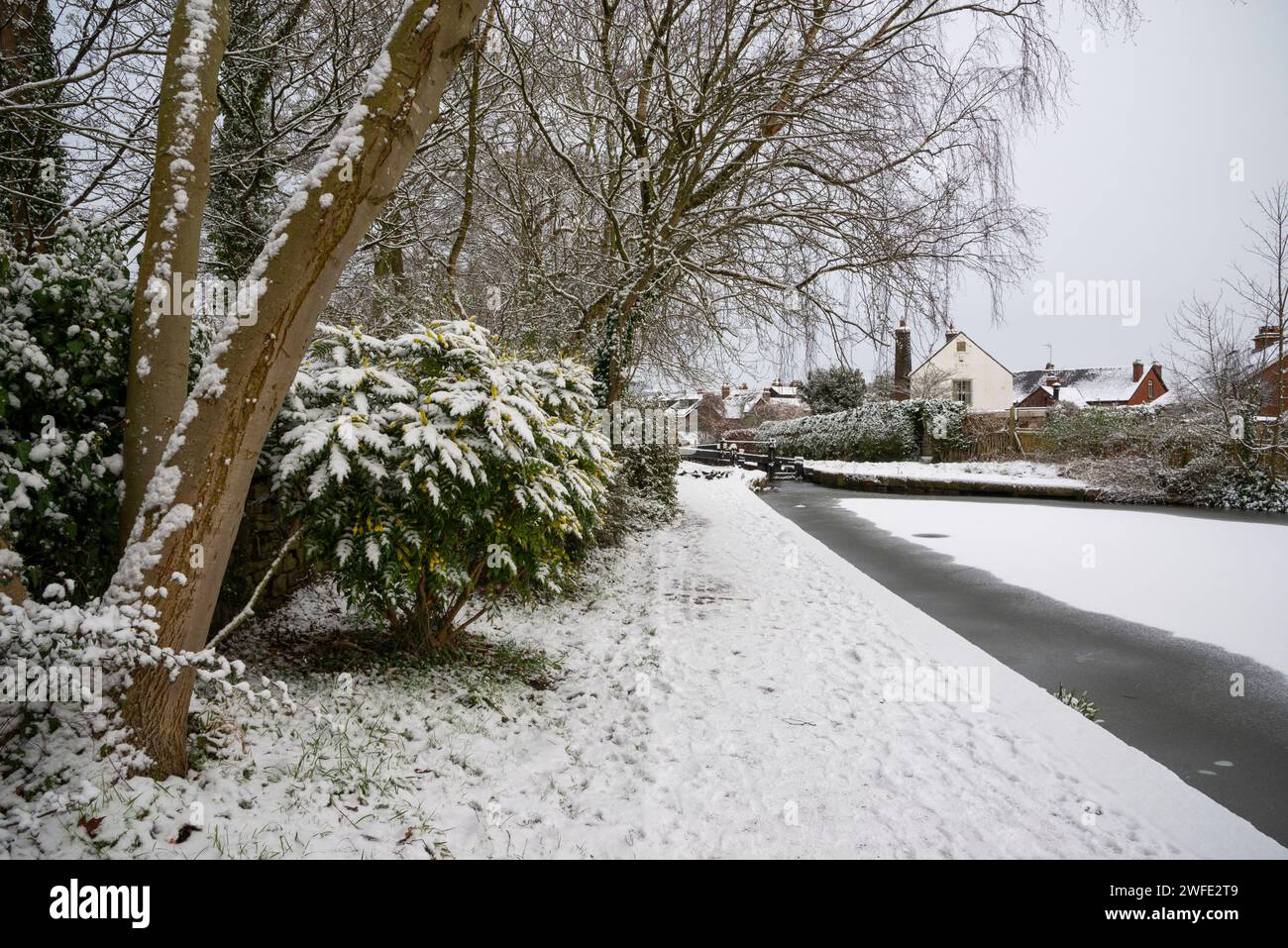 A snowy winter morning on the Peak Forest Canal at Marple in Greater Manchester, England. Stock Photo