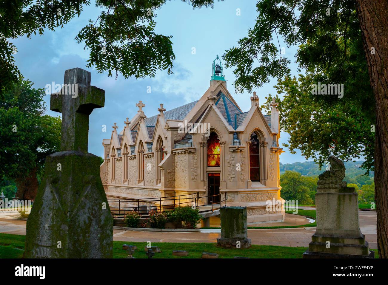 Memorial Chapel. Calvary Cemetery Chapel. Evening view. Calvary Cemetery, Dayton, Ohio, USA. Note that a breeze has created some fuzzy leaves due to Stock Photo