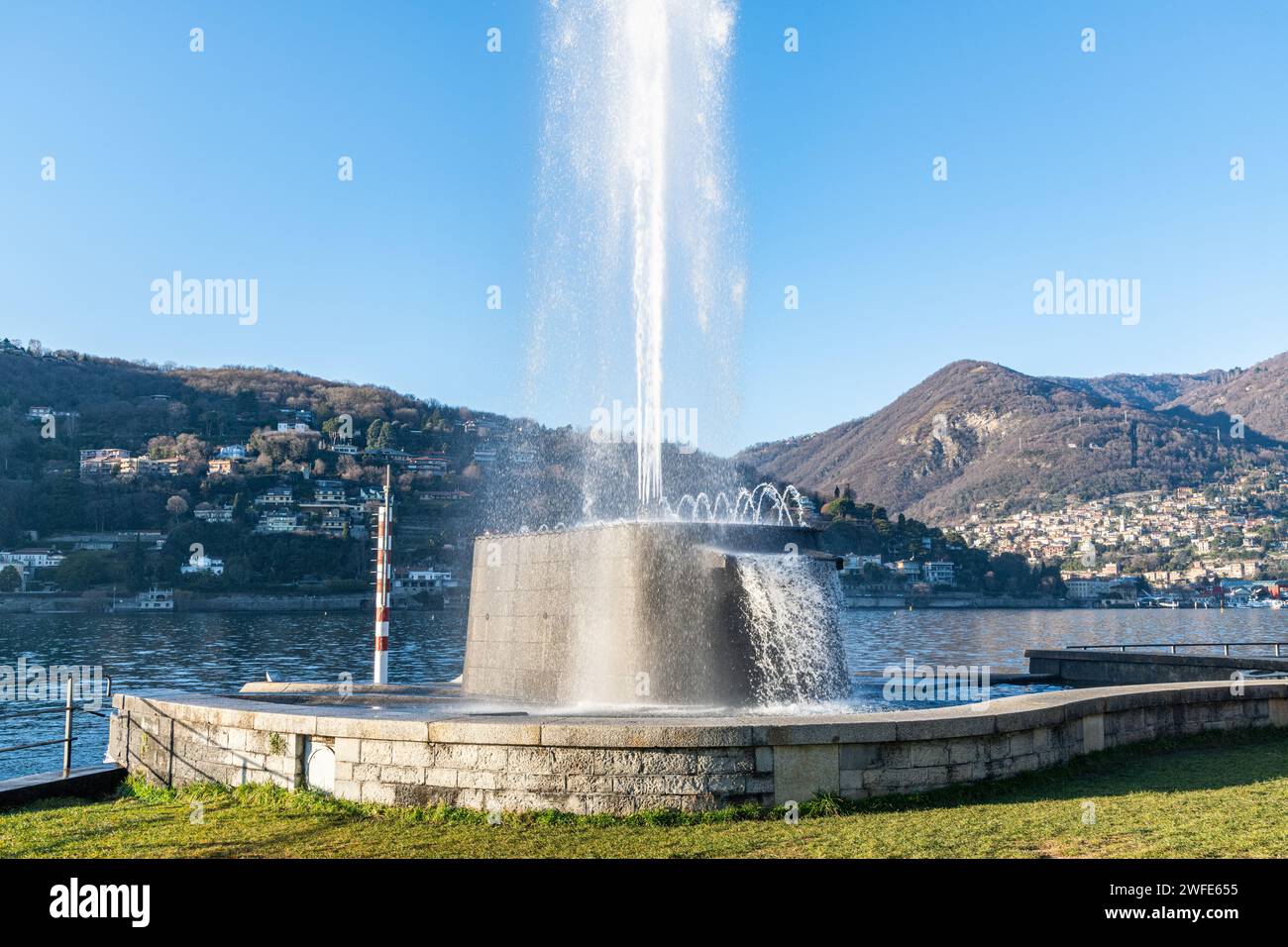 A water fountain display by Lake Como in Como, Italy Stock Photo