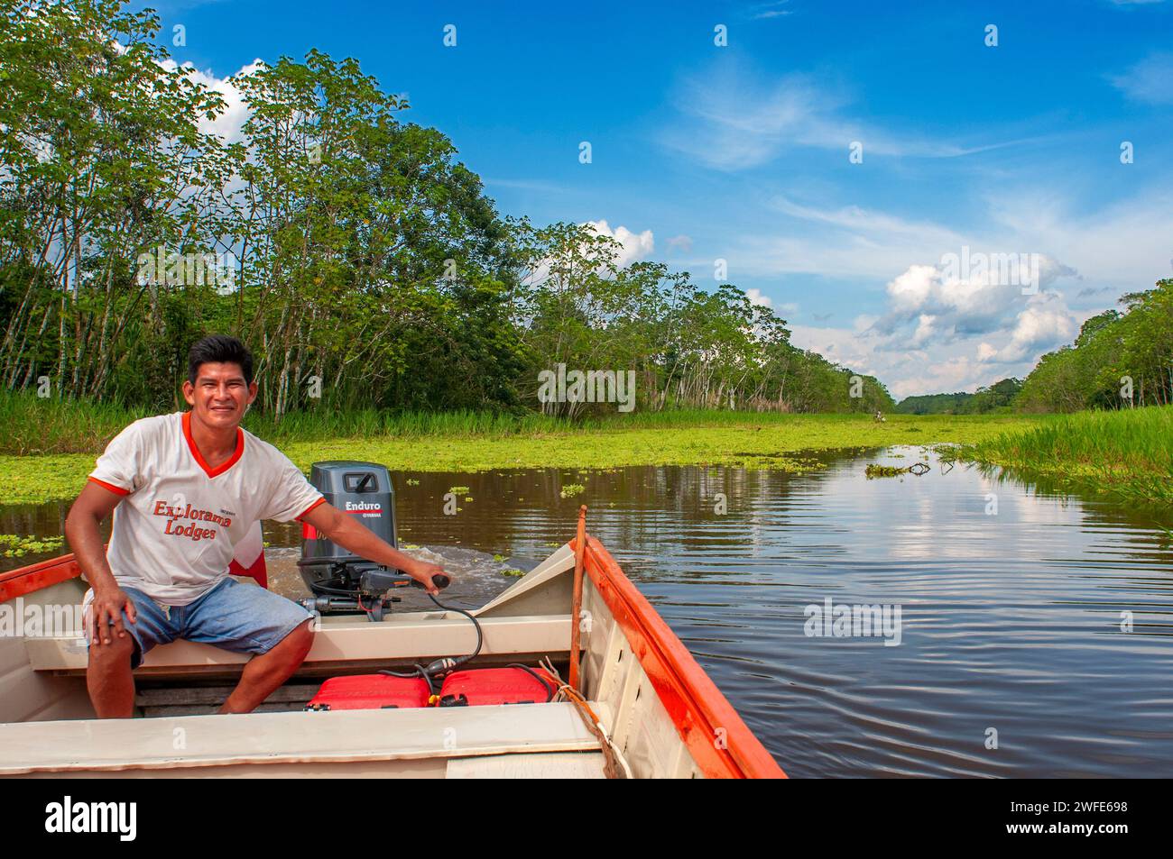 Amazon river Expedition by boat along the Amazon River near Iquitos, Loreto, Peru. Navigating one of the tributaries of the Amazon to Iquitos about 40 Stock Photo