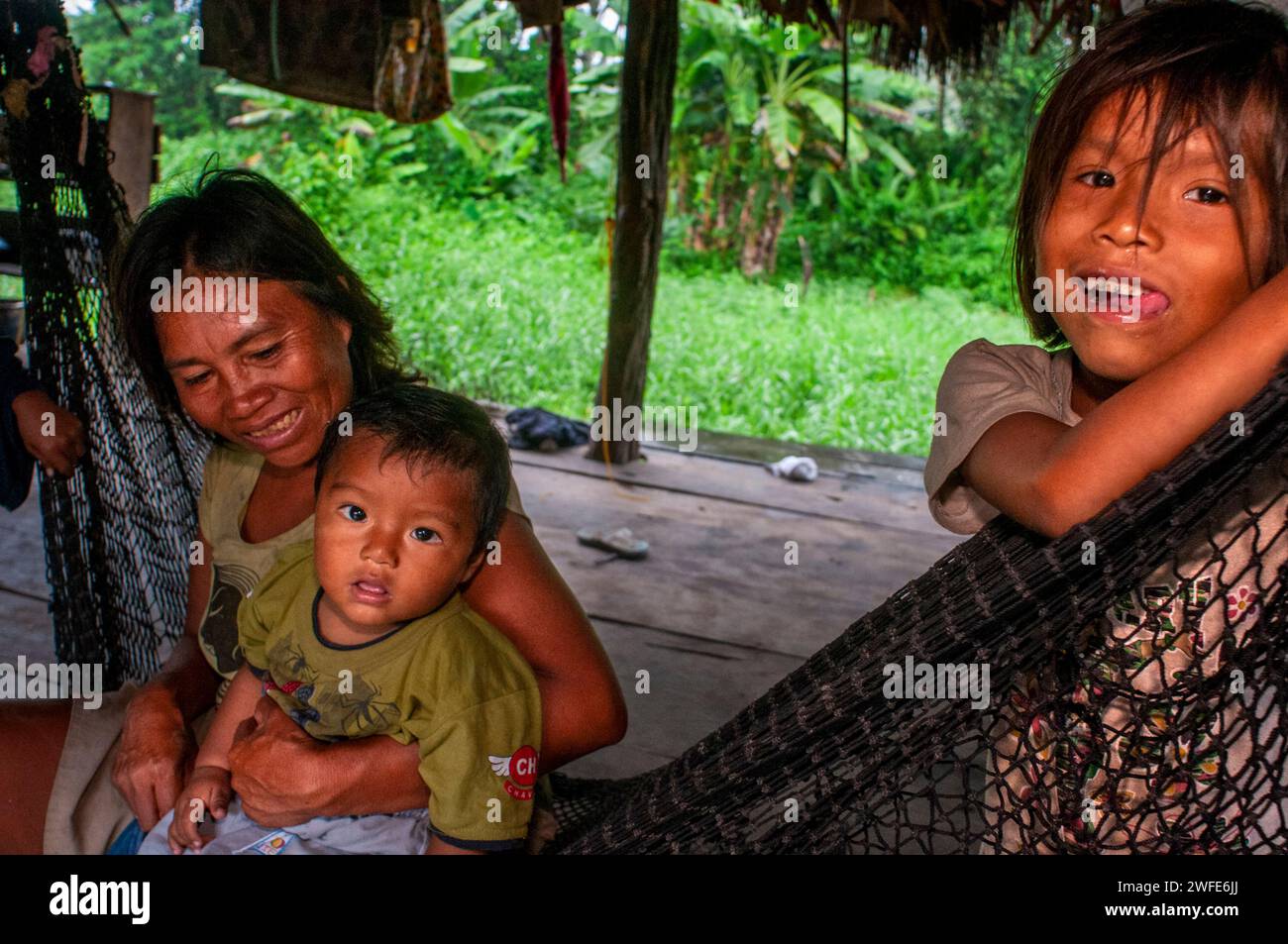 Local family in the riverside village of Timicuro I. Iqutios peruvian amazon, Loreto, Peru Stock Photo