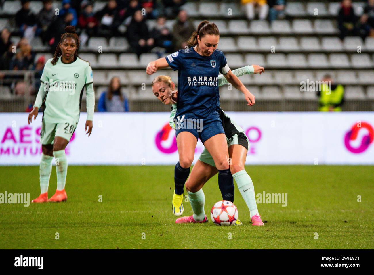 Sophie Ingle of Chelsea and Gaetane Thiney of Paris FC fight for the ball during the UEFA Women's Champions League, Group D football match between Paris FC and Chelsea on January 30, 2024 at Sebastien Charlety stadium in Paris, France Stock Photo