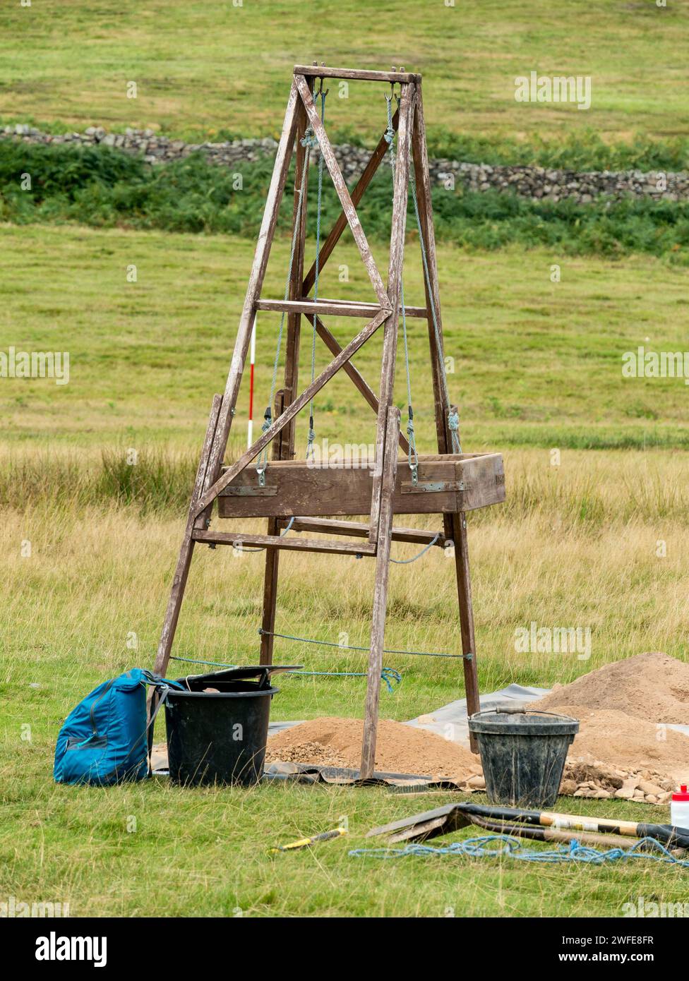 Tripod / A-frame mounted archeology sieve / sifter / screen in Bradgate Park, Leicestershire, England, UK Stock Photo