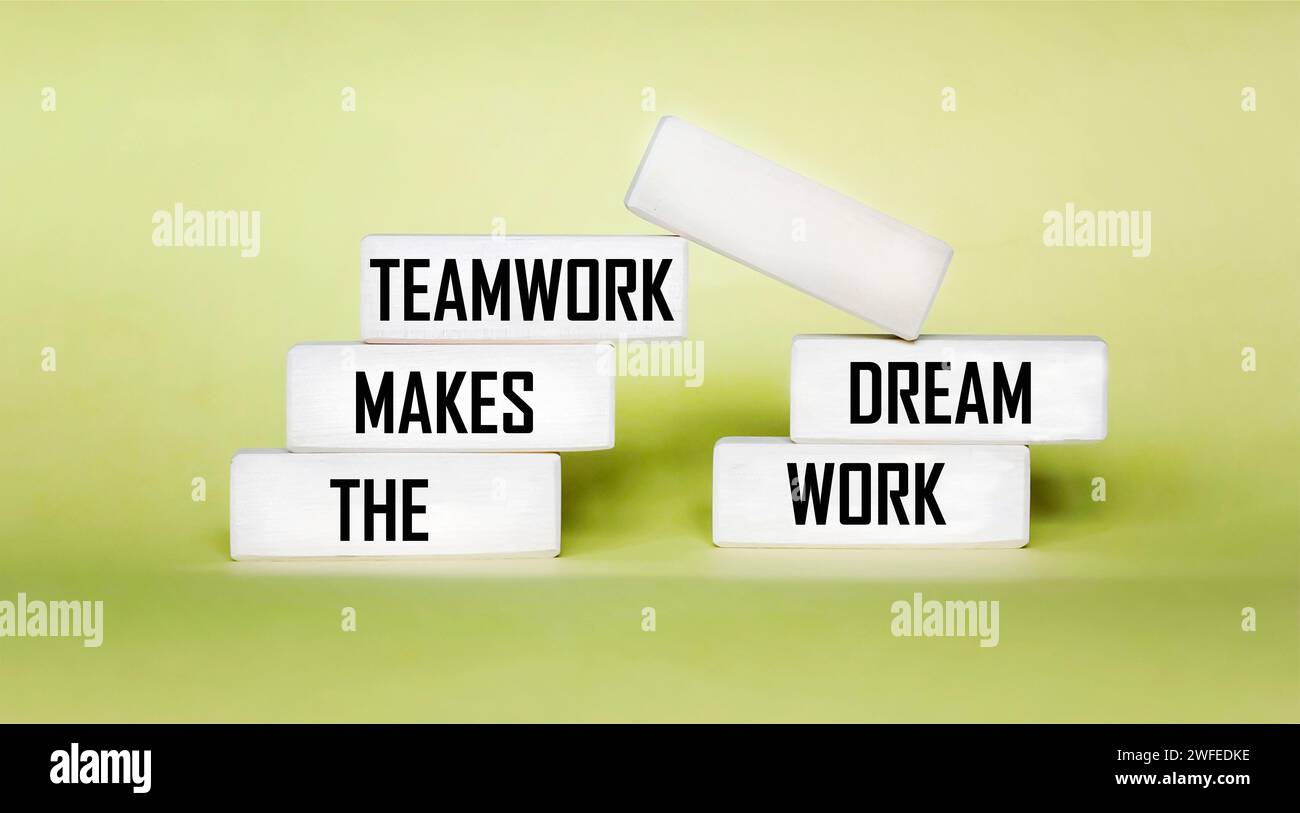 TMDW Teamwork makes the dream work symbol. Conceptual words TMDW Teamwork doing your dream job on a wooden block on a beautiful yellow background. Stock Photo