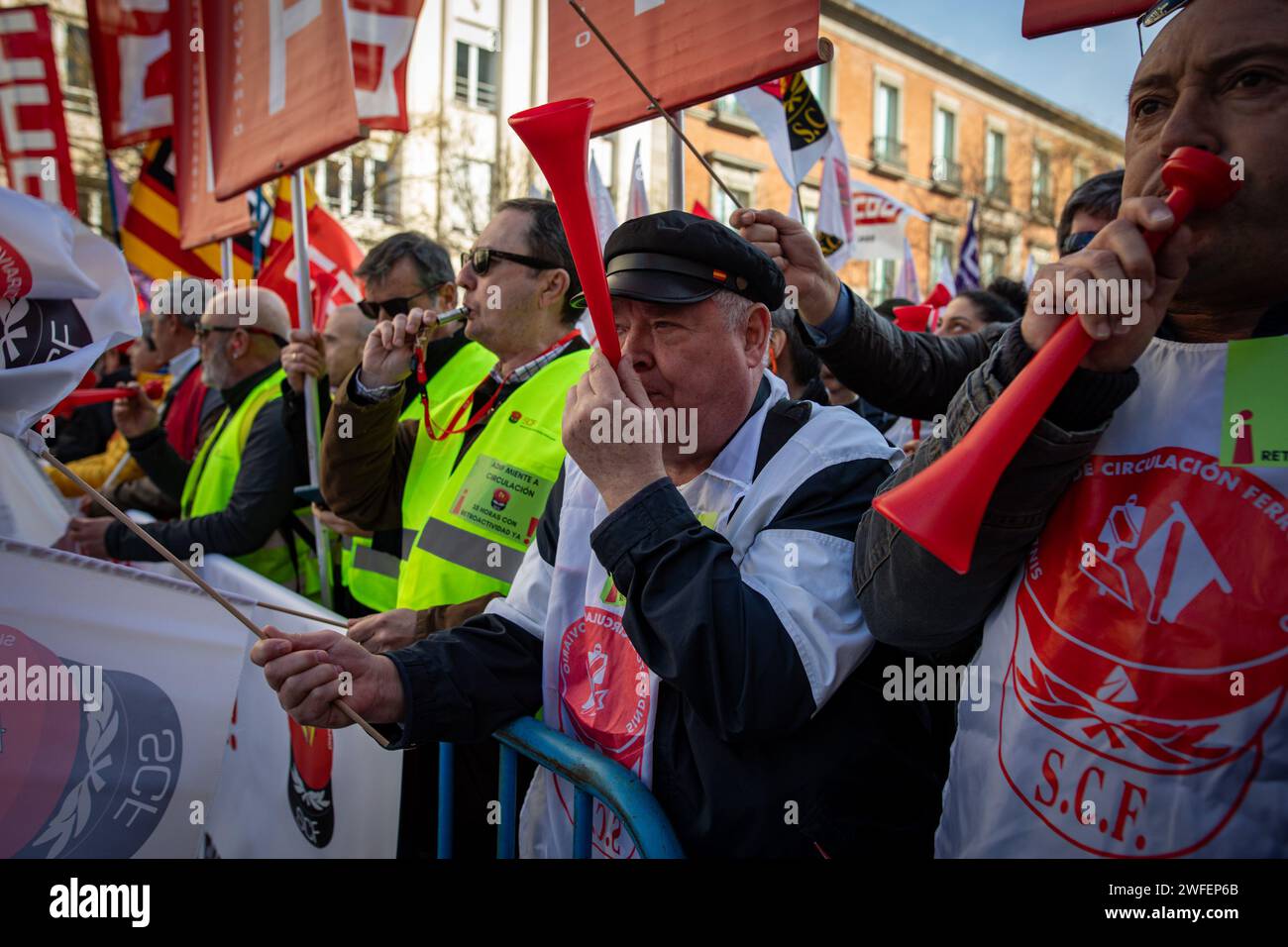 Madrid, Spain. 30th Jan, 2024. Railway protesters blow vuvuzelas during the rally in front of the Congress of Deputies. The workers' union, Comisiones Obreras, has called a rally in front of the Congress of Deputies to demand the unblocking of the agreements on the elimination of entry categories in Renfe (National Network of Spanish Railways) and on the implementation of the 35-hour day in Adif (railway infrastructure administrator) (Photo by David Canales/SOPA Images/Sipa USA) Credit: Sipa USA/Alamy Live News Stock Photo