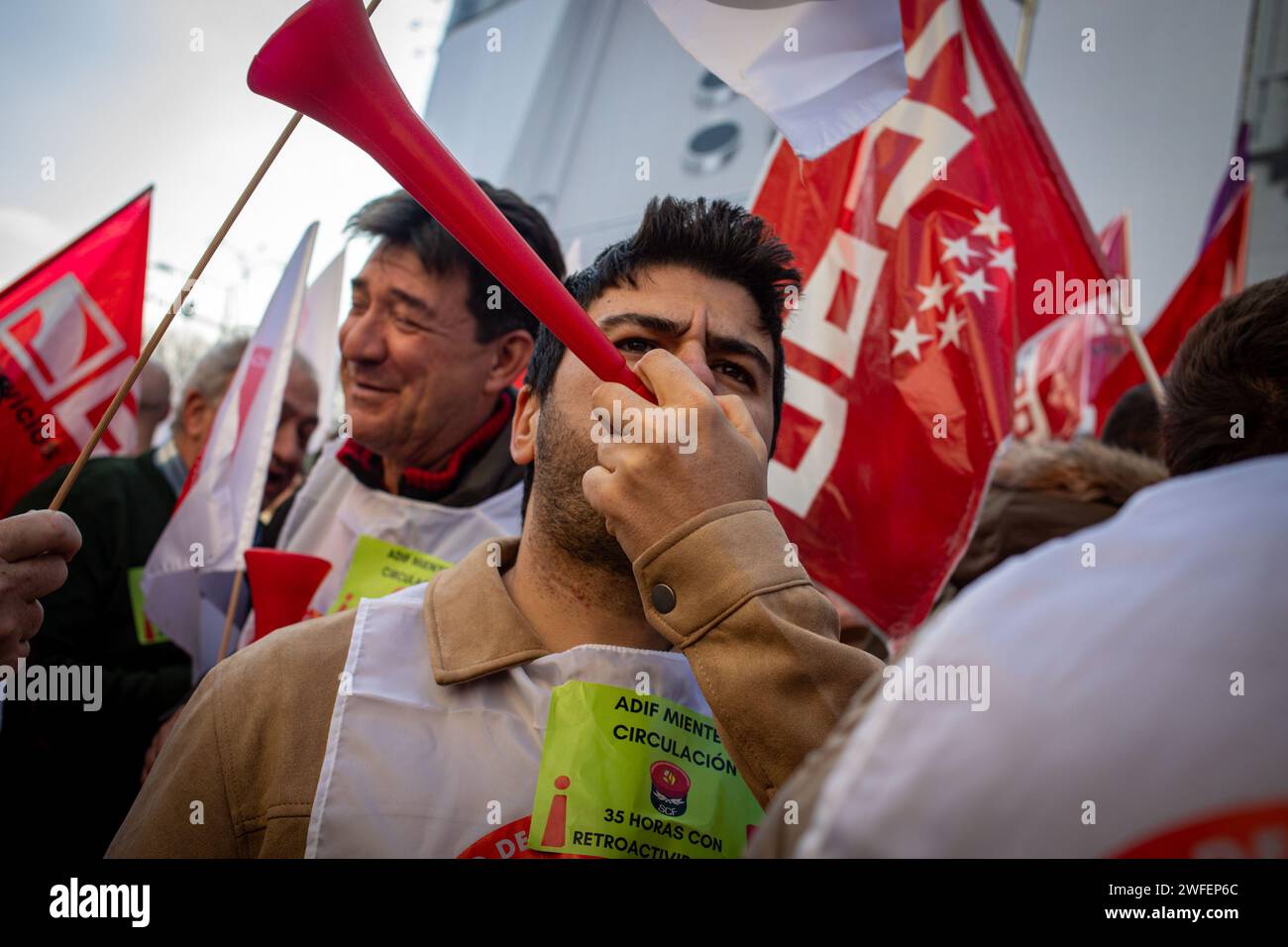 Madrid, Spain. 30th Jan, 2024. Railway protesters blow vuvuzelas during the rally in front of the Congress of Deputies. The workers' union, Comisiones Obreras, has called a rally in front of the Congress of Deputies to demand the unblocking of the agreements on the elimination of entry categories in Renfe (National Network of Spanish Railways) and on the implementation of the 35-hour day in Adif (railway infrastructure administrator) (Photo by David Canales/SOPA Images/Sipa USA) Credit: Sipa USA/Alamy Live News Stock Photo