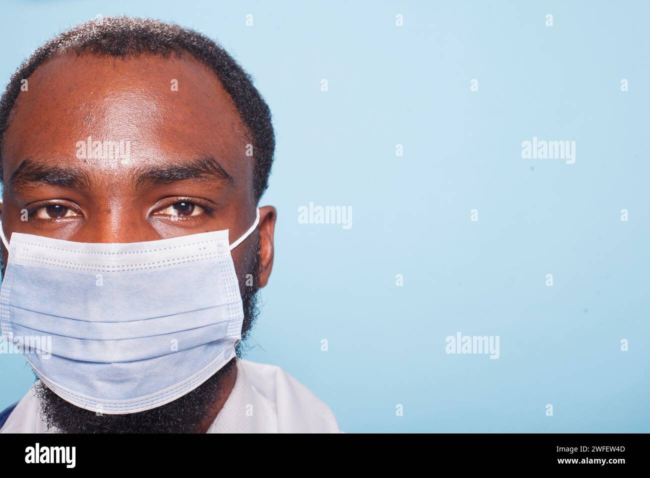 Close up of male nurse wearing blue surgical face mask hi-res stock ...