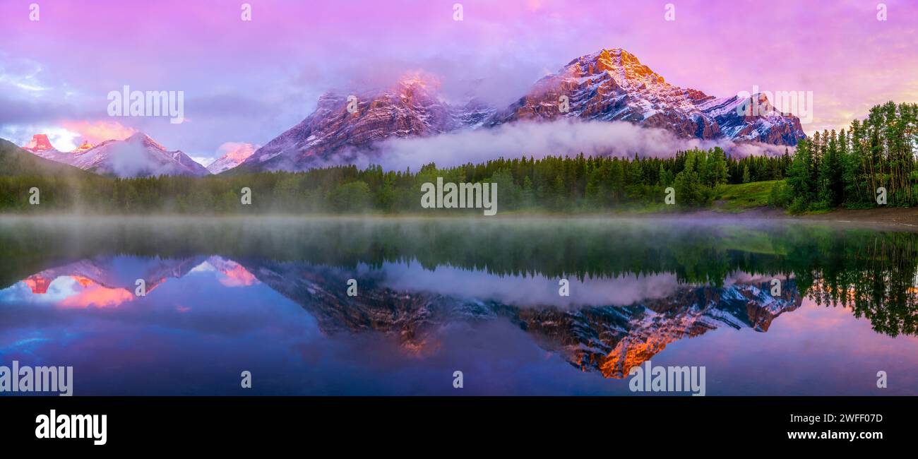 Mountain reflecting in lake, Wedge Pond, Mount Kidd, Alberta, Canada Stock Photo