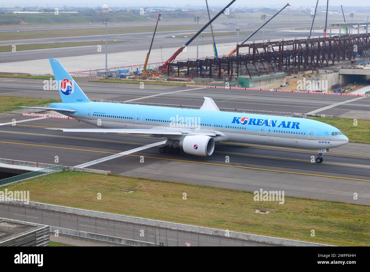 Korean Air Boeing 777 aircraft taxiing. Airplane 777-300ER of Korean Air, also know as Korean Airlines. Stock Photo