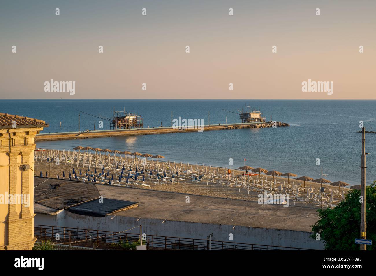 View of the popular beach and pier of the seaside village of San Vito